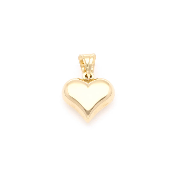 Dije hueco motivo corazón en oro amarillo 14 kilates.