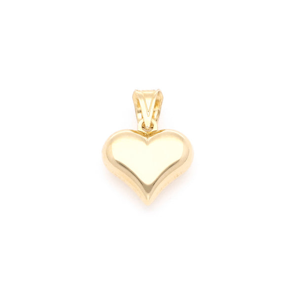 Dije hueco motivo corazón en oro amarillo 14 kilates.