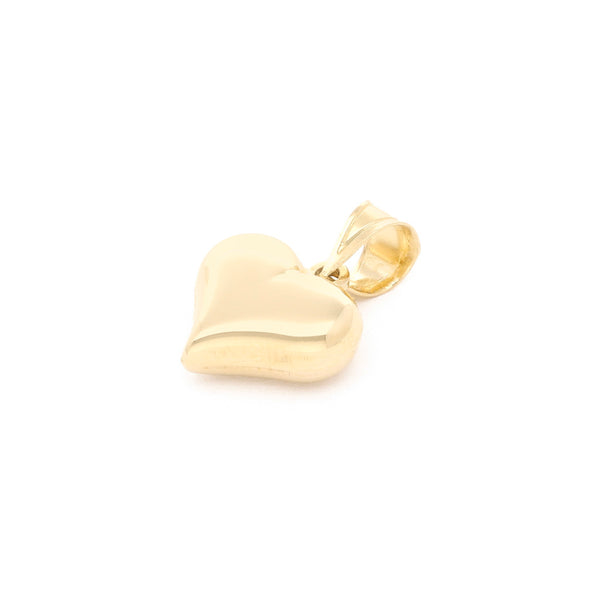 Dije hueco motivo corazón en oro amarillo 14 kilates.