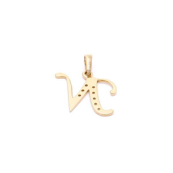 Dije diseño especial motivo letra N con circonias en oro amarillo 14 kilates.
