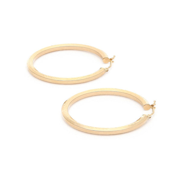 Arracadas martilladas en oro amarillo 14 kilates.