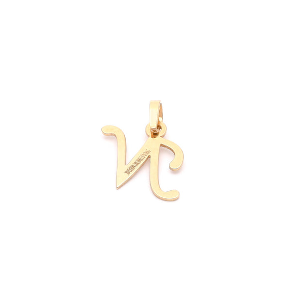 Dije liso motivo letra N en oro amarillo 14 kilates.