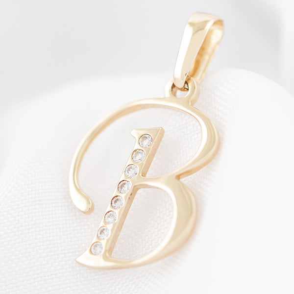 Dije diseño especial motivo letra B con circonias en oro amarillo 14 kilates.