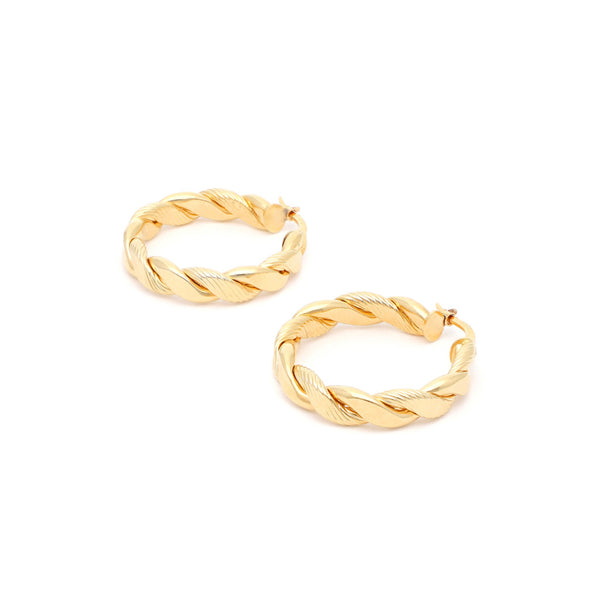 Arracadas trenzadas en oro amarillo 14 kilates.