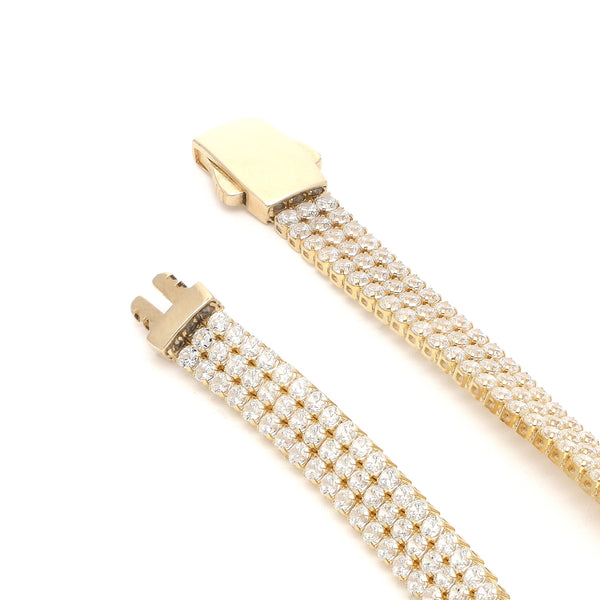 Pulsera eslabón articulado con circonias en oro amarillo 14 kilates.