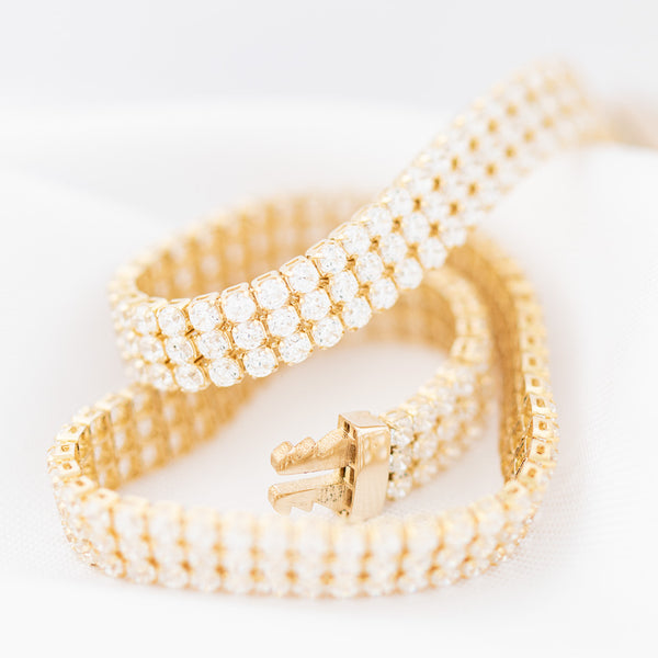 Pulsera eslabón articulado con circonias en oro amarillo 14 kilates.