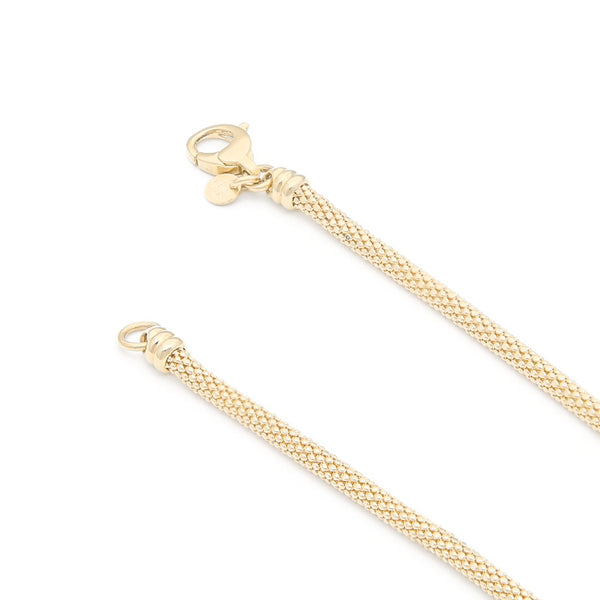 Pulsera eslabón tejido con colgantes motivo corazón en oro amarillo 14 kilates.