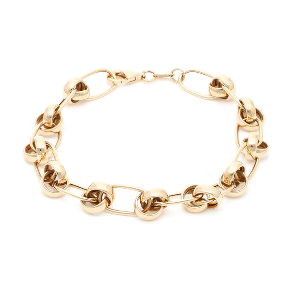 Pulsera eslabón cruzado con aplicaciones en oro amarillo 14 kilates.
