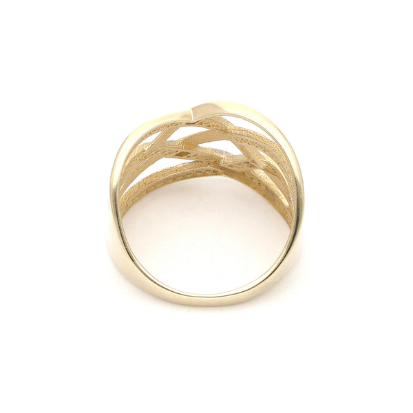 Anillo calado con circonias en oro amarillo 14 kilates.