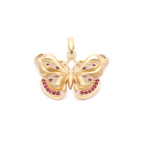 Dije diseño especial motivo mariposa con sintéticos en oro amarillo 14 kilates.