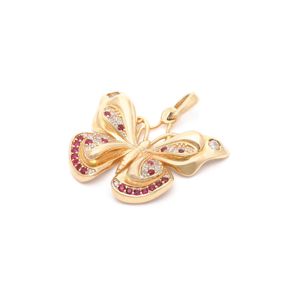 Dije diseño especial motivo mariposa con sintéticos en oro amarillo 14 kilates.