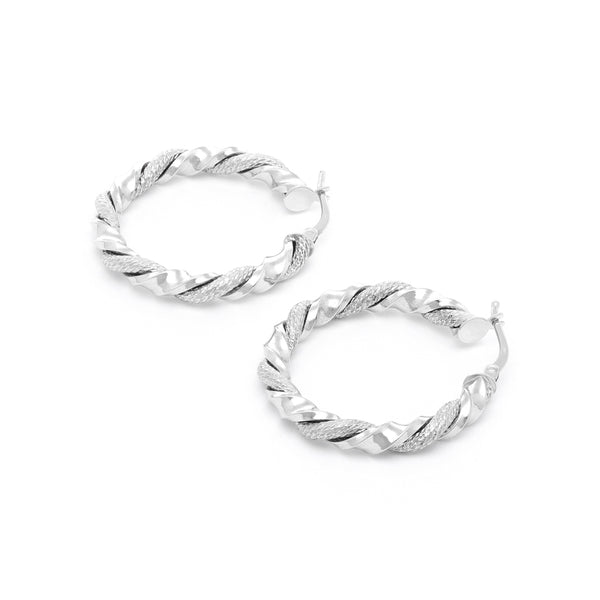 Arracadas torzal en oro blanco 14 kilates.