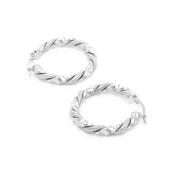 Arracadas torzal en oro blanco 14 kilates.