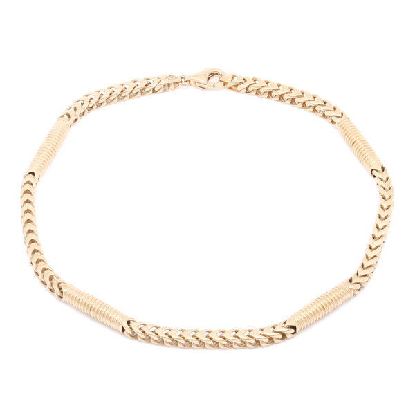 Pulsera eslabón combinado en oro amarillo 14 kilates.