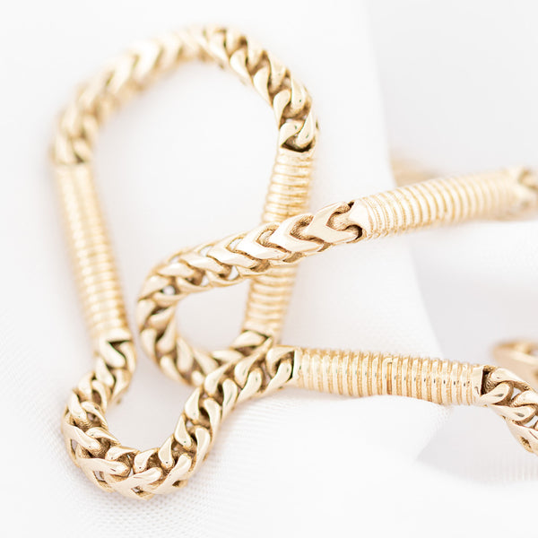 Pulsera eslabón combinado en oro amarillo 14 kilates.