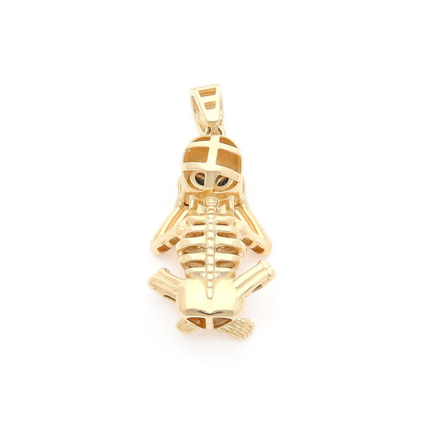 Dije diseño especial motivo esqueleto en oro amarillo 14 kilates.