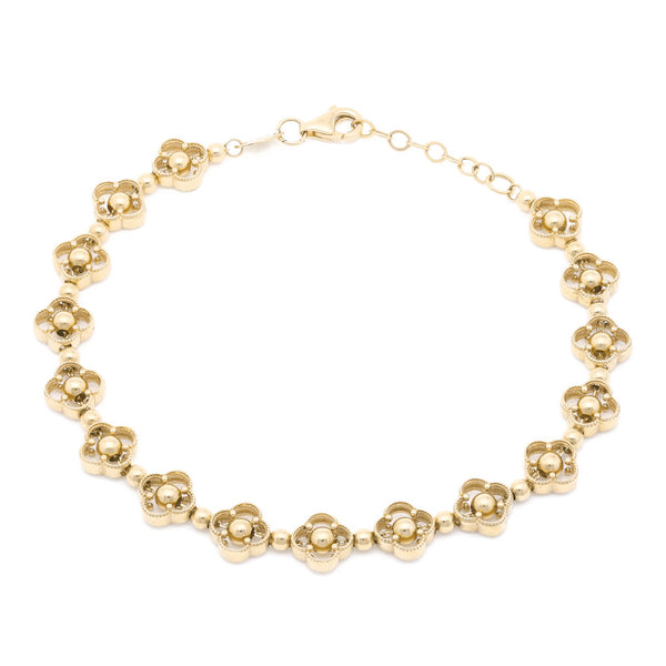 Pulsera eslabón articulado motivo flor en oro amarillo 14 kilates.