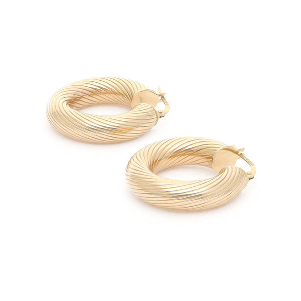 Arracadas huecas en oro amarillo 14 kilates.