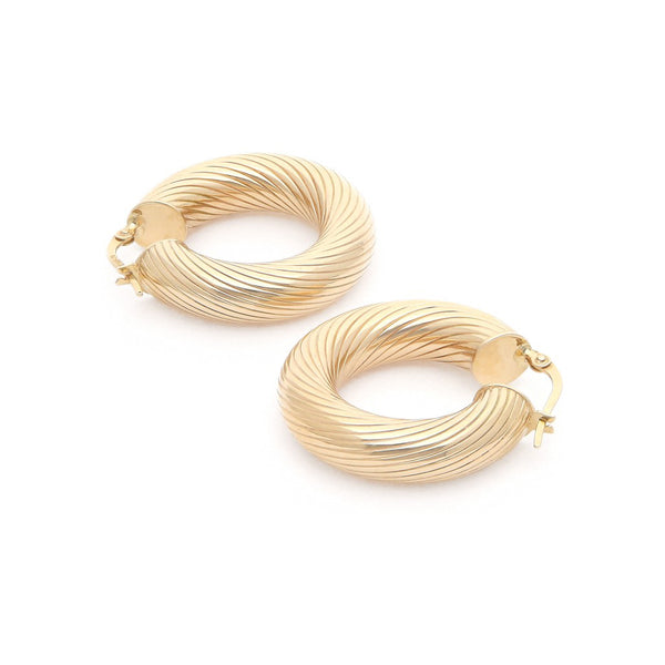 Arracadas huecas en oro amarillo 14 kilates.