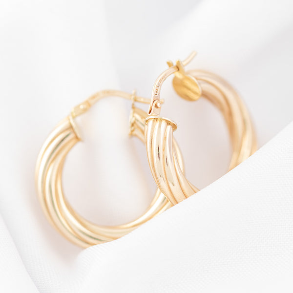 Arracadas torzal en oro amarillo 14 kilates.
