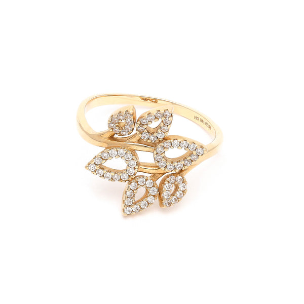 Anillo calado motivo hojas con circonias en oro amarillo 14 kilates.