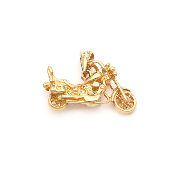 Dije diseño especial motivo motocicleta en oro amarillo 14 kilates.