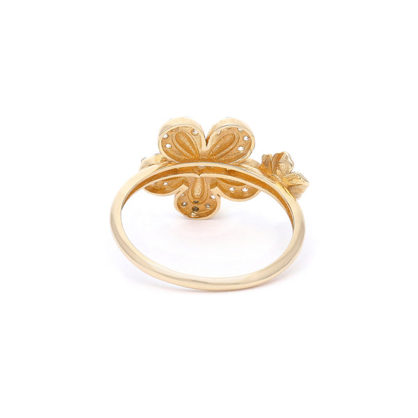 Anillo diseño especial motivo flores con circonias en oro amarillo 14 kilates.