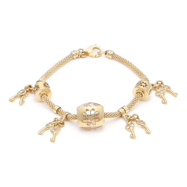 Pulsera eslabón tejido con aplicaciones y colgantes motivo llaves en oro amarillo 14 kilates.