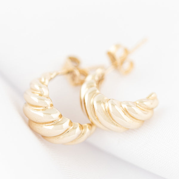 Aretes torzales en oro amarillo 14 kilates.