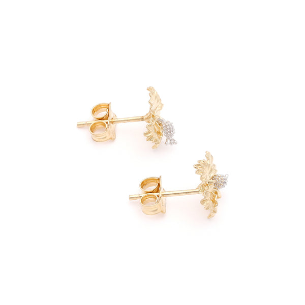 Aretes diseño especial motivo flor en oro dos tonos 14 kilates.