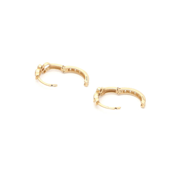 Arracadas articuladas en oro amarillo 14 kilates.