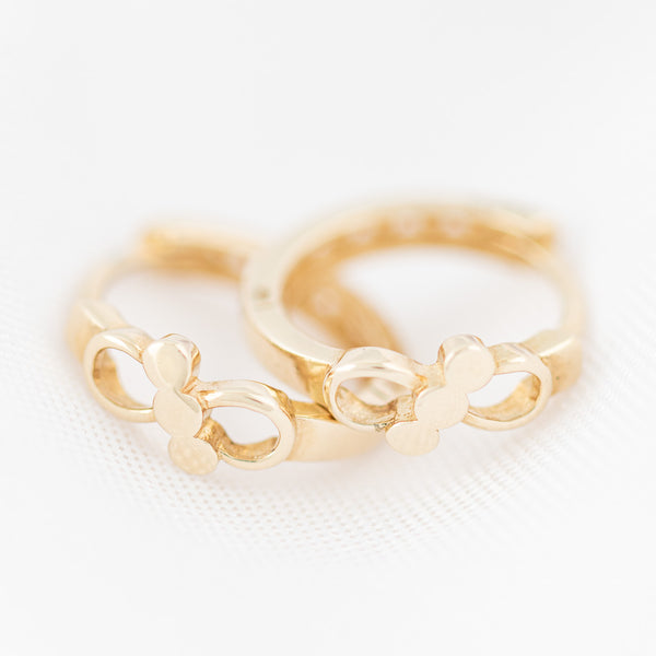 Arracadas articuladas en oro amarillo 14 kilates.