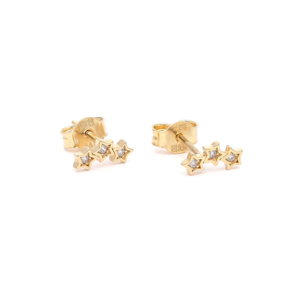 Aretes diseño especial con circonias motivo estrellas en oro amarillo 14 kilates.