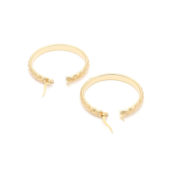 Arracadas facetadas en oro amarillo 14 kilates.