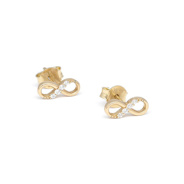 Aretes diseño especial con circonias motivo infinito en oro amarillo 14 kilates.