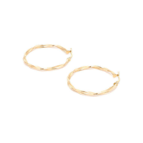 Arracadas torzal en oro amarillo 14 kilates.