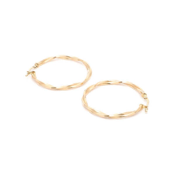 Arracadas torzal en oro amarillo 14 kilates.
