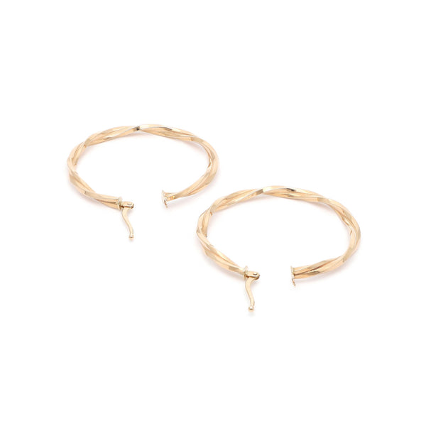 Arracadas torzal en oro amarillo 14 kilates.