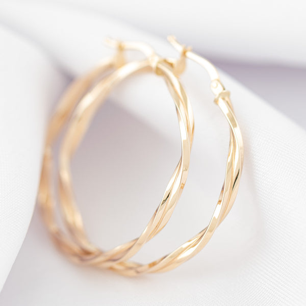 Arracadas torzal en oro amarillo 14 kilates.