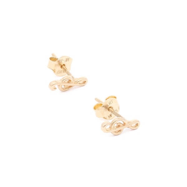Aretes calados motivo nota musical en oro amarillo 14 kilates.