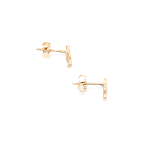 Aretes calados motivo nota musical en oro amarillo 14 kilates.