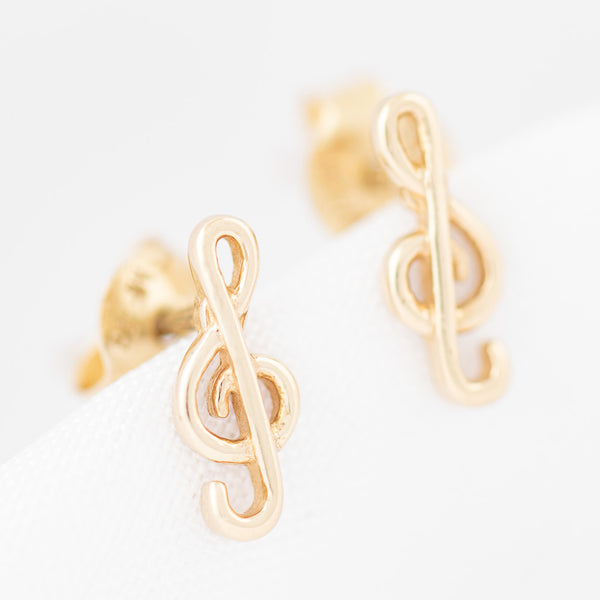 Aretes calados motivo nota musical en oro amarillo 14 kilates.