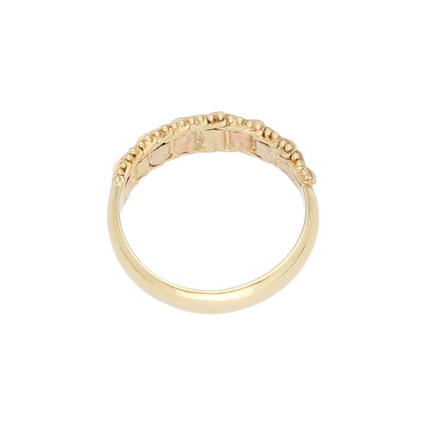 Anillo boleado en oro tres tonos 14 kilates.