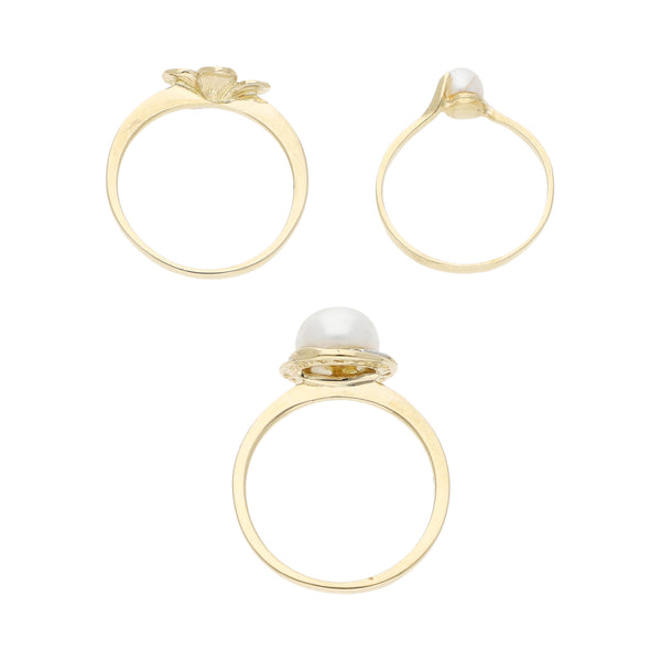 Tres anillos diseño especial con perlas y circonias en oro amarillo 14 kilates.