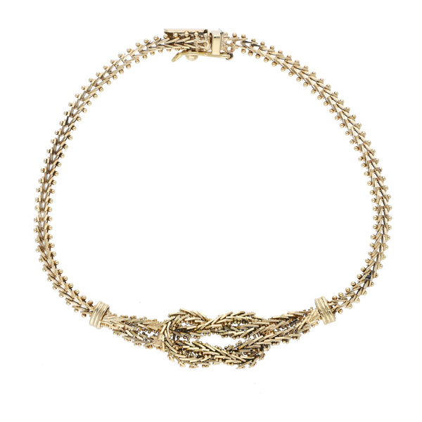 Pulsera eslabón boleado con aplicaciones en oro amarillo 14 kilates.