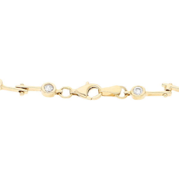 Pulsera eslabón articulado con circonias en oro amarillo 14 kilates.