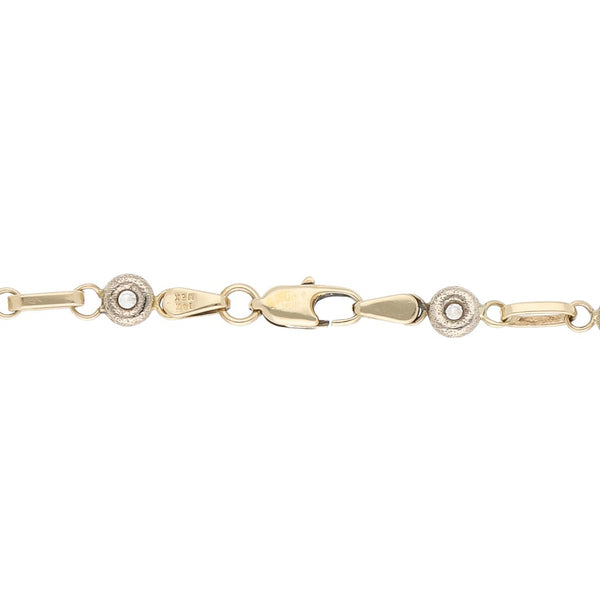 Pulsera eslabón articulado con sintéticos en oro dos tonos 14 kilates.
