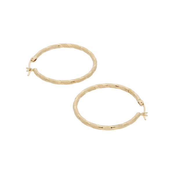 Arracadas labradas en oro amarillo 14 kilates.