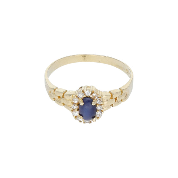 Anillo diseño especial con zafiro estrella y sintéticos en oro amarillo 14 kilates.