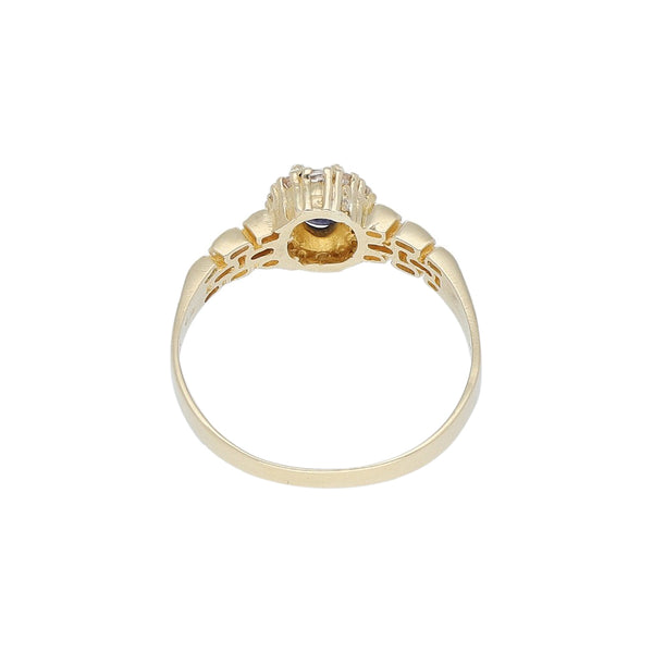 Anillo diseño especial con zafiro estrella y sintéticos en oro amarillo 14 kilates.